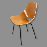 Pierre Guariche, France, a Tonneau chair, the leather clad shell seat on black tubular steel legs,