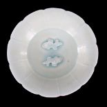 A small Chinese celadon glaze bowl with relief moulded fish design, diameter 15cm