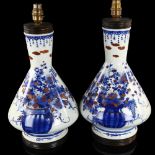 A pair of Chinese blue and white porcelain table lamps, with hand painted and gilded decoration,