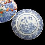 An 18th century Chinese blue and white plate with hand painted decoration, diameter 32cm (restored),