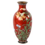 A Japanese red ground cloisonne enamel vase, decorated with exotic flowers, late 19th/early 20th