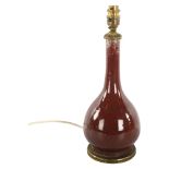 A Chinese sang de boeuf glaze porcelain table lamp, height excluding fitting 30cm