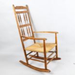 Neville Neal, an Arts and Crafts Cotswold School Ernest Gimson design back rocking chair in ash with