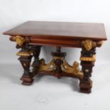 An early 20th Century walnut centre table, with carved surround and carved winged Lion stretcher,