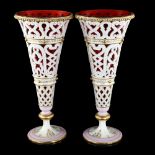 A pair of late 19th century pierced white glaze porcelain vases, with gilded decoration and