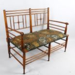 Liberty and Co, an Arts and Crafts Argyll 2 seatre bench settee, ca 1890, later upholstered with