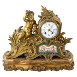 An early 19th century gilt-bronze cased mantel clock by Raingo Frere Paris, Rococo style case