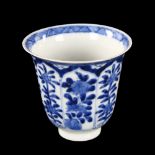 A Chinese blue and white porcelain cup, with painted floral panels and 6 character mark, height 8cm,