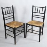A pair of Morris & Company, Arts and Crafts spindle back ebonised Sussex chairs with rush seats,