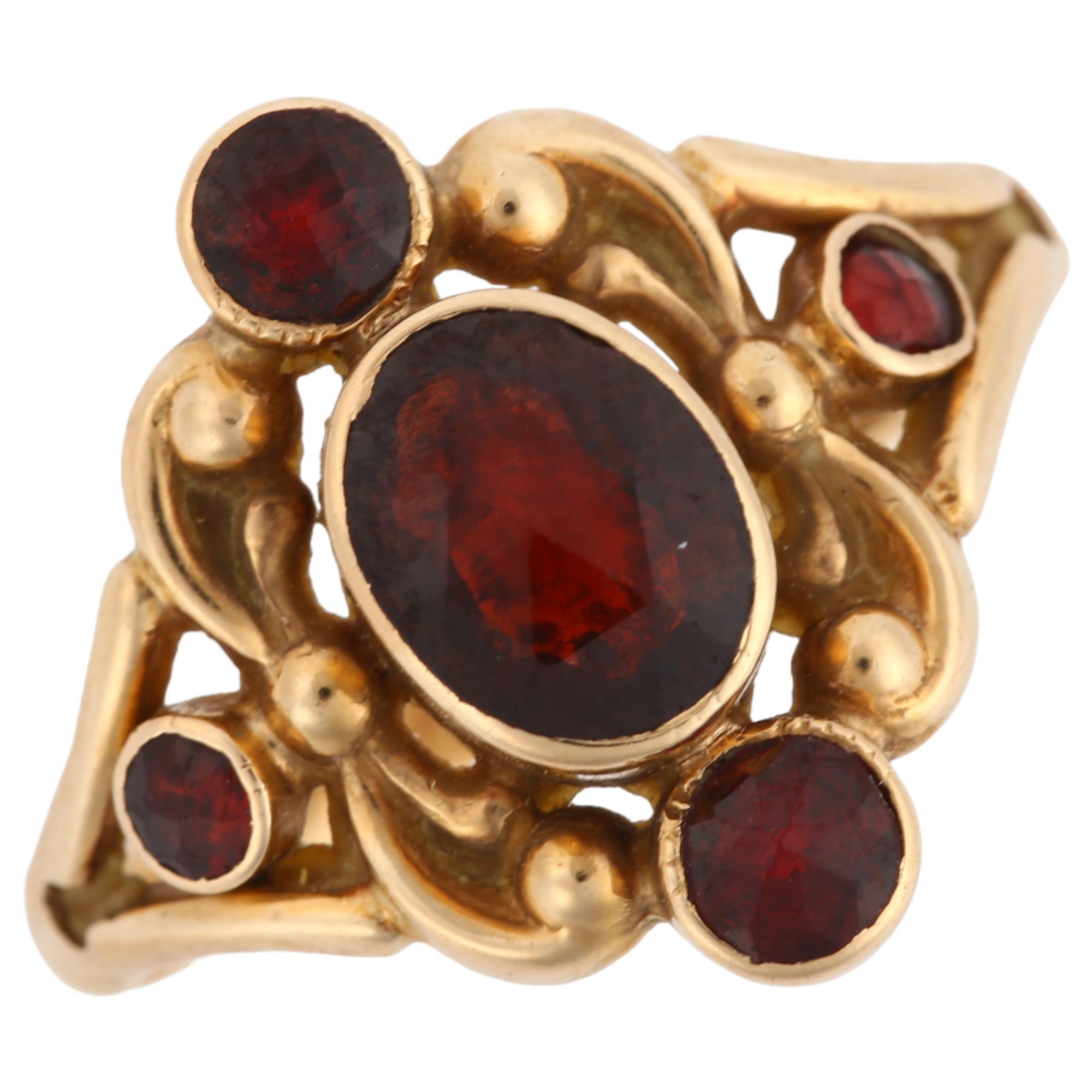 A 14ct gold garnet dress ring, set with rose-cut garnets and foliate decoration, maker's marks CN,