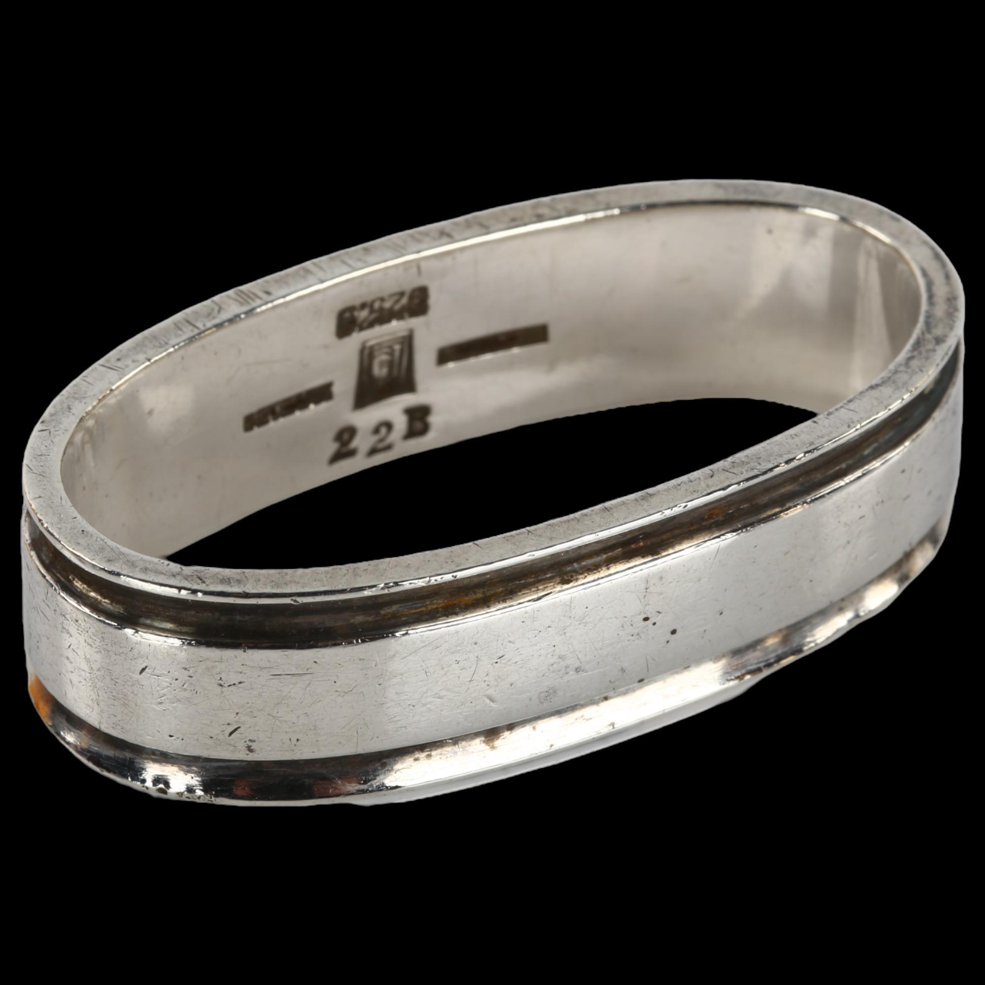 GEORG JENSEN - a Danish modernist sterling silver napkin ring, designed by Harald Nielsen, model no.