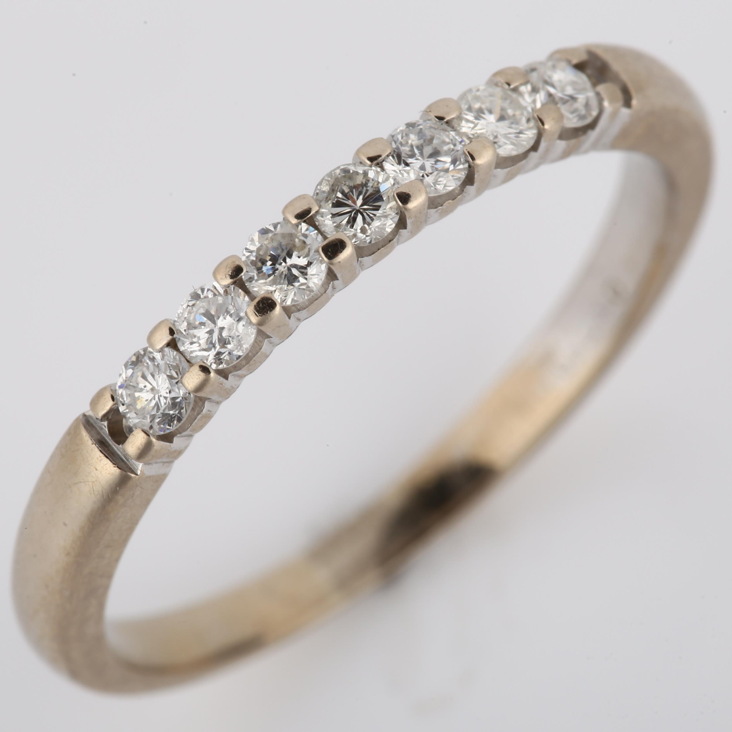 An 18ct white gold seven stone diamond ring, set with modern round brilliant-cut diamonds, total - Image 2 of 4