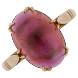 A 9ct rose gold carbuncle garnet ring, set with oval cabochon garnet, setting height 13.5mm, size O,