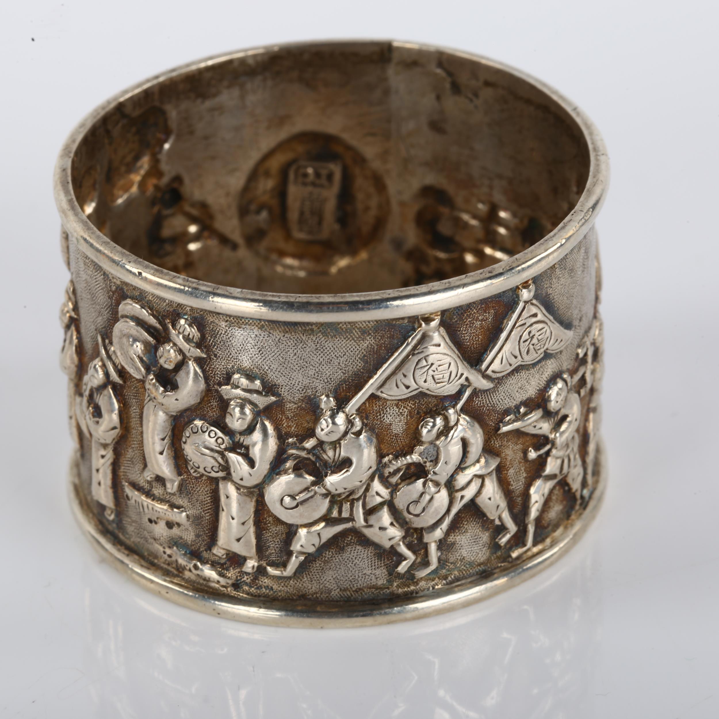 A Chinese export silver napkin ring, musical procession decoration, by Tuck Chang, circa 1900, - Image 2 of 3