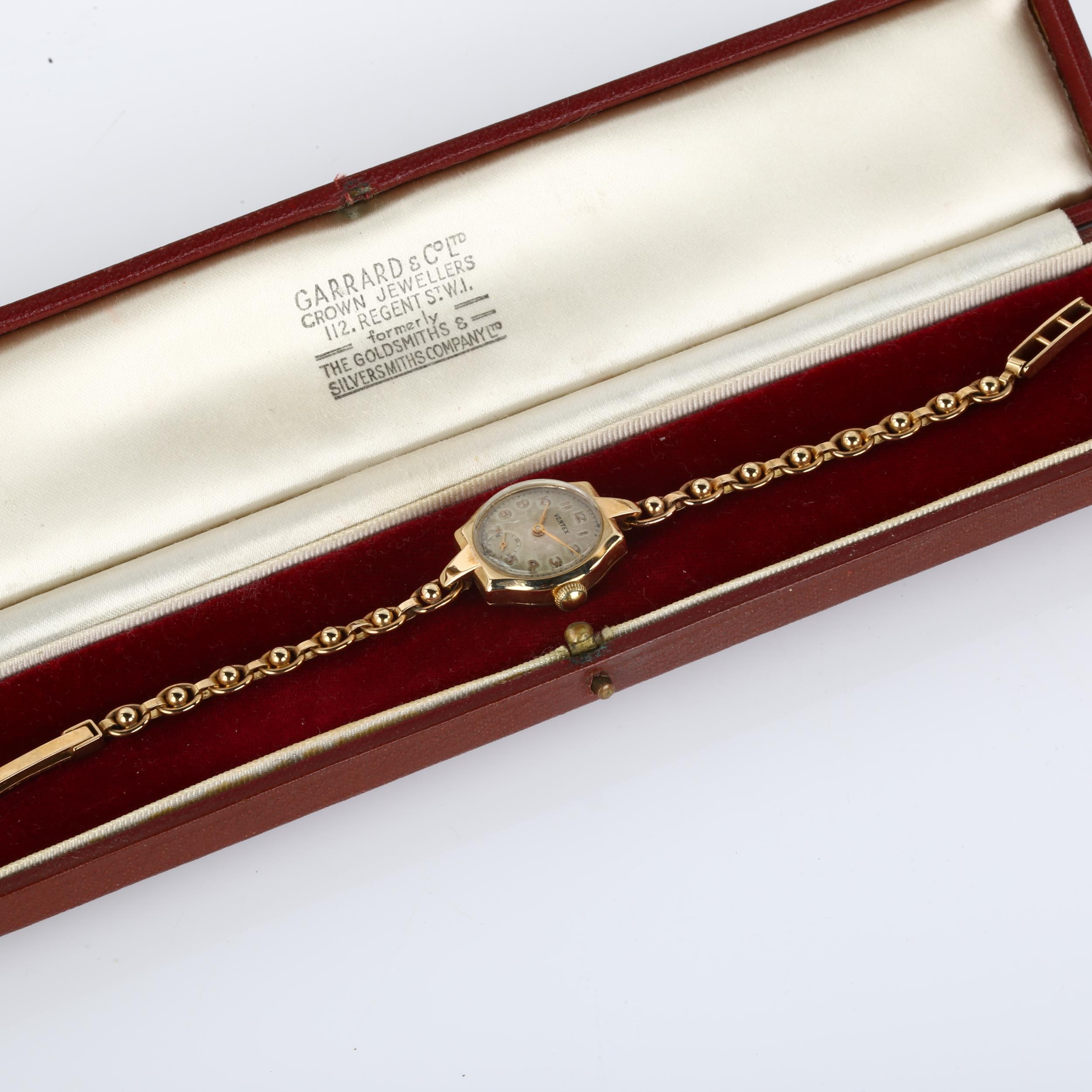 VERTEX - a lady's 9ct gold mechanical bracelet watch, circa 1952, silvered dial with gilt Arabic - Image 5 of 5