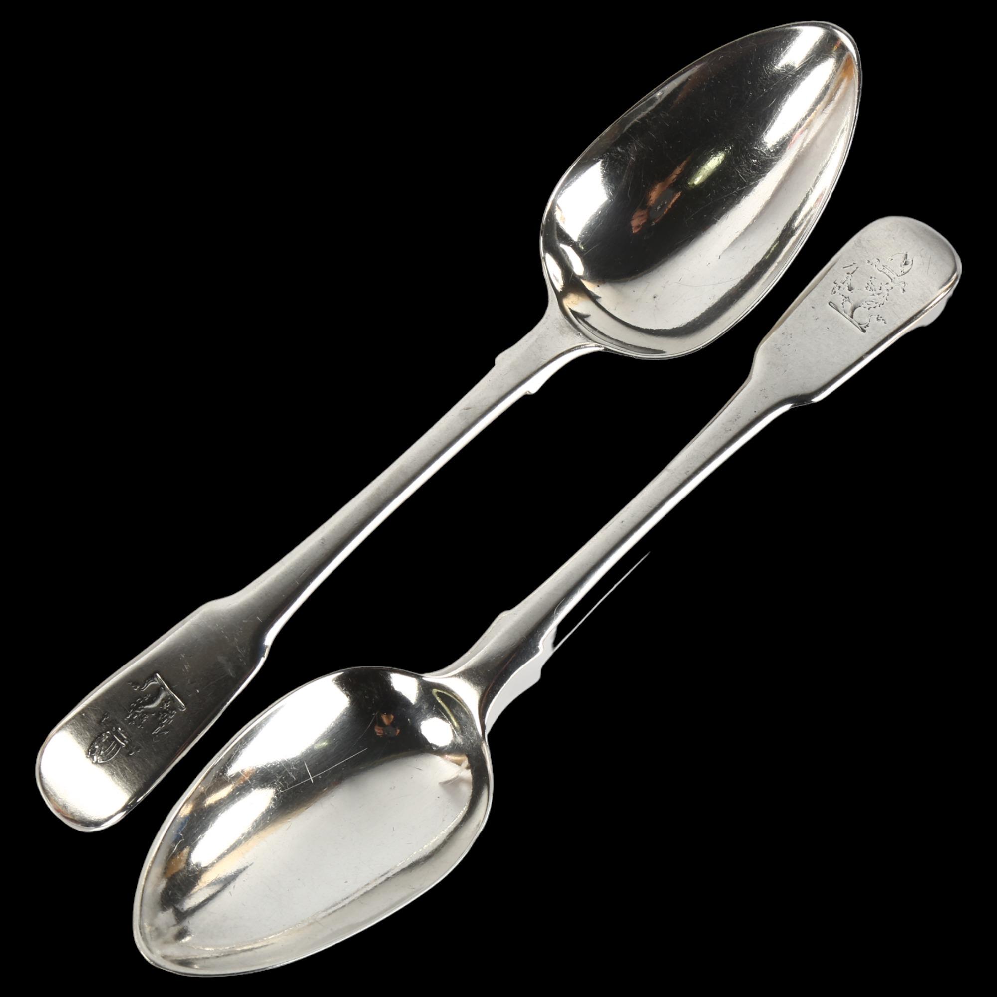 A pair of George III silver Fiddle pattern serving spoons, with Bishop's armorial crest, by