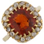 An 18ct gold hessonite garnet and diamond cluster ring, set with cushion-cut garnet and rose-cut