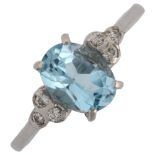 A late 20th century 18ct white gold aquamarine and diamond dress ring set with oval mixed-cut aqua