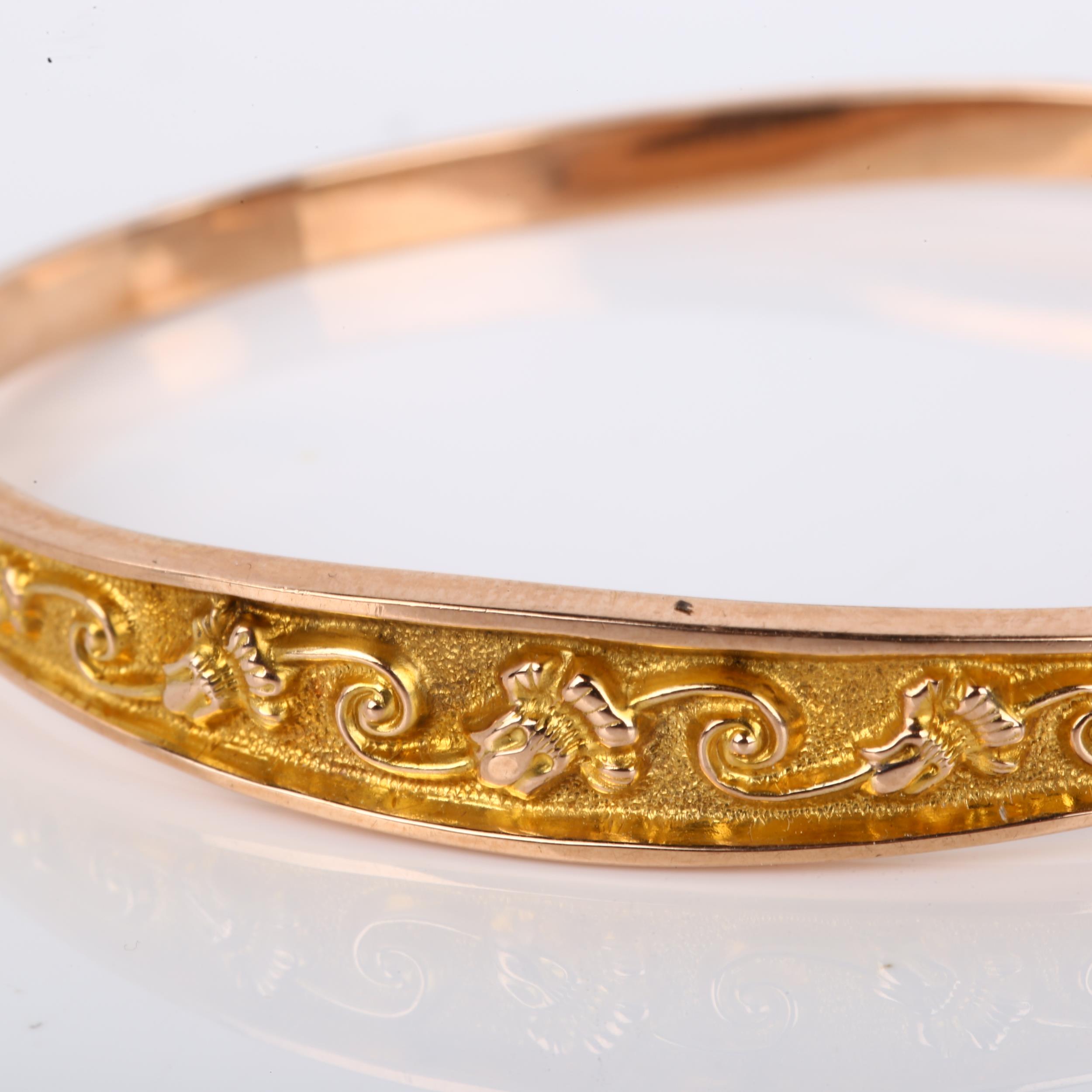 An early 20th century 9ct gold hinged bangle, relief embossed foliate decoration, maker's marks S - Image 2 of 4