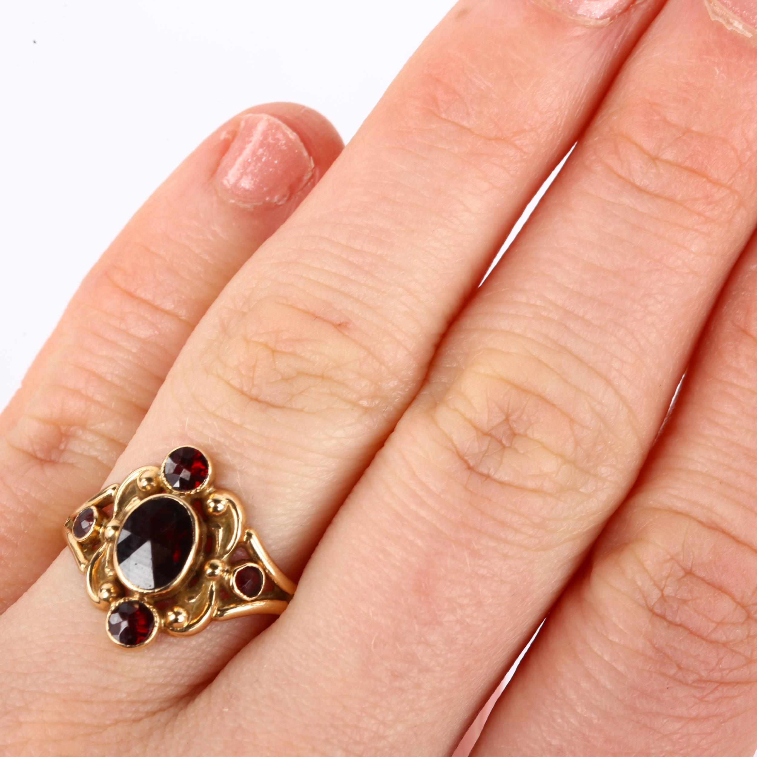 A 14ct gold garnet dress ring, set with rose-cut garnets and foliate decoration, maker's marks CN, - Image 4 of 4