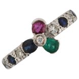 An 18ct white gold gem set flowerhead ring, gemstones include ruby sapphire emerald and diamond,