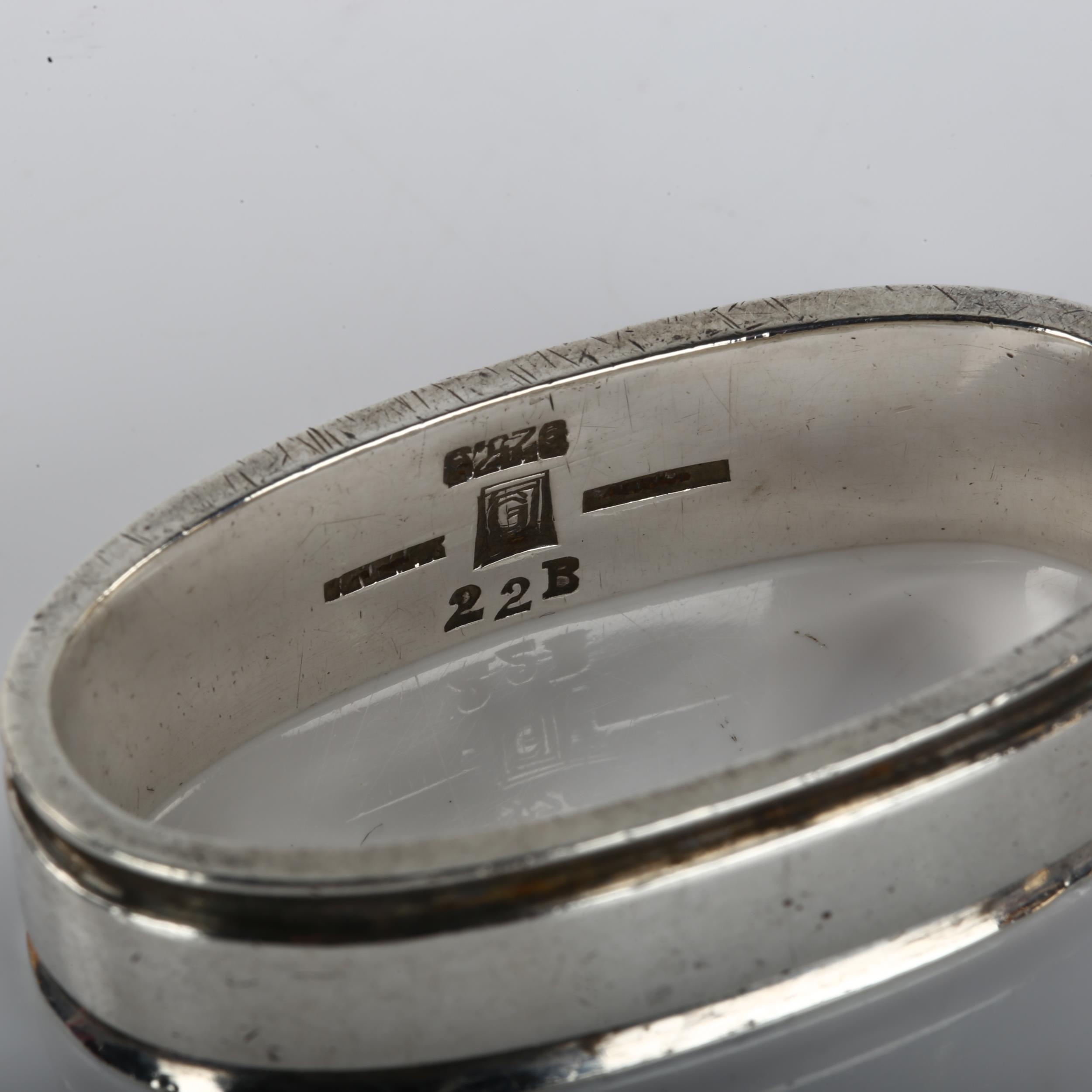 GEORG JENSEN - a Danish modernist sterling silver napkin ring, designed by Harald Nielsen, model no. - Image 2 of 3