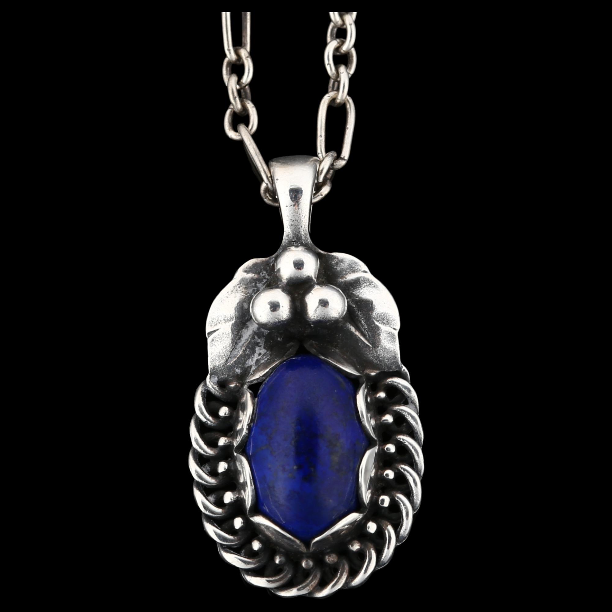 GEORG JENSEN - a Danish stylised sterling silver and lapis lazuli pendant necklace of the year 1992,