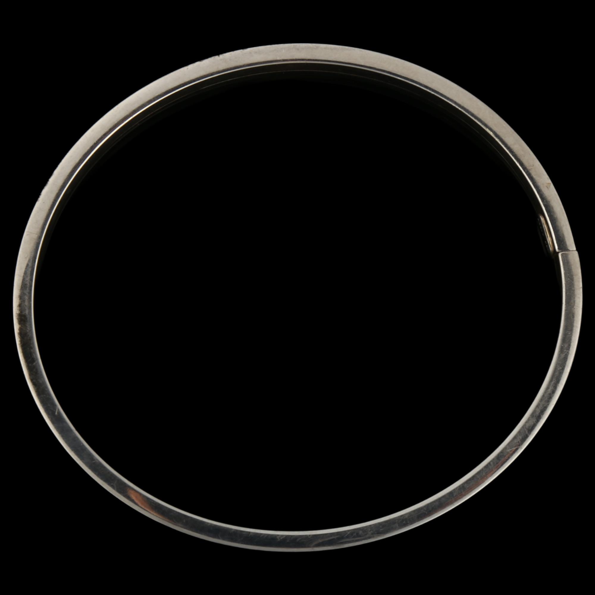 PER E LANGE - a Danish sterling silver plain form torque bangle, band width 6mm, internal