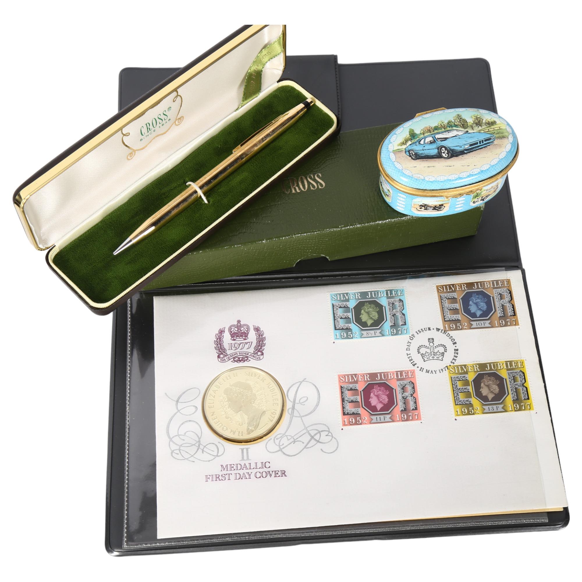An Elizabeth II 1977 silver-gilt medallic First Day Cover coin and stamps, in original case, a Cross