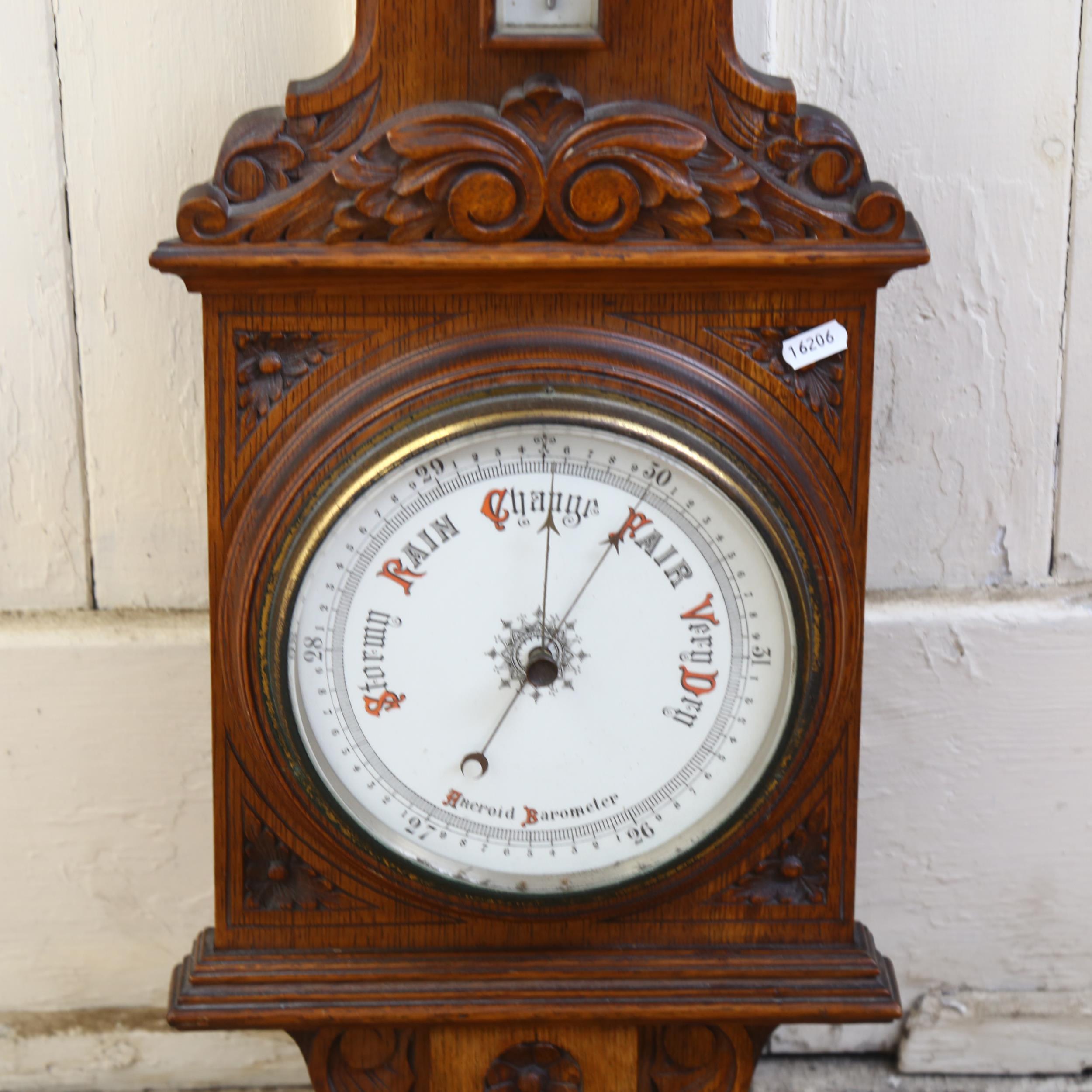 A carved oak-case aneroid wall barometer with thermometer, H99cm - Image 2 of 2