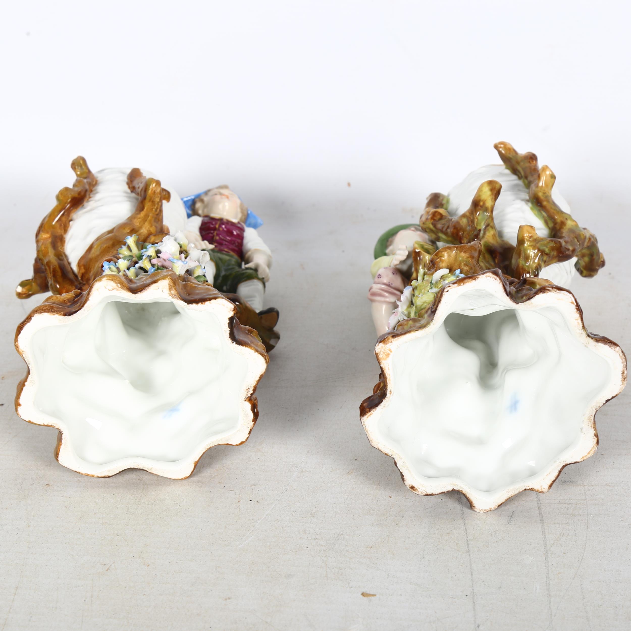 A pair of Vintage German porcelain vases, surmounted by boy figures on flower strewn bases, - Image 2 of 2