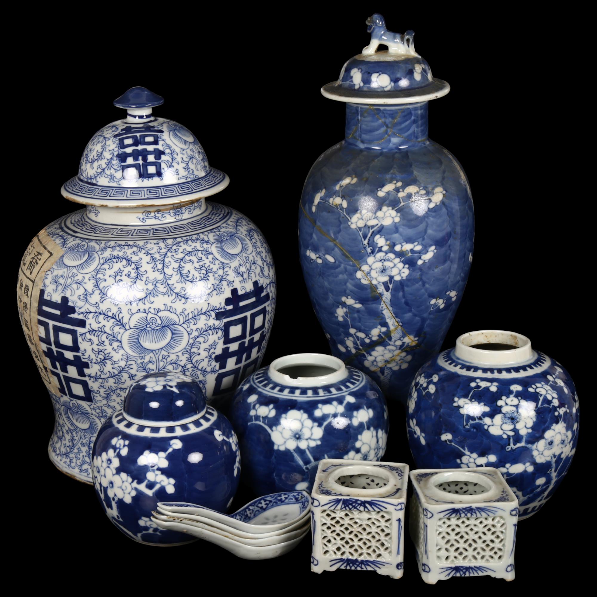 A group of Chinese blue and white vases, to include a large baluster vase with lid, 3 prunus