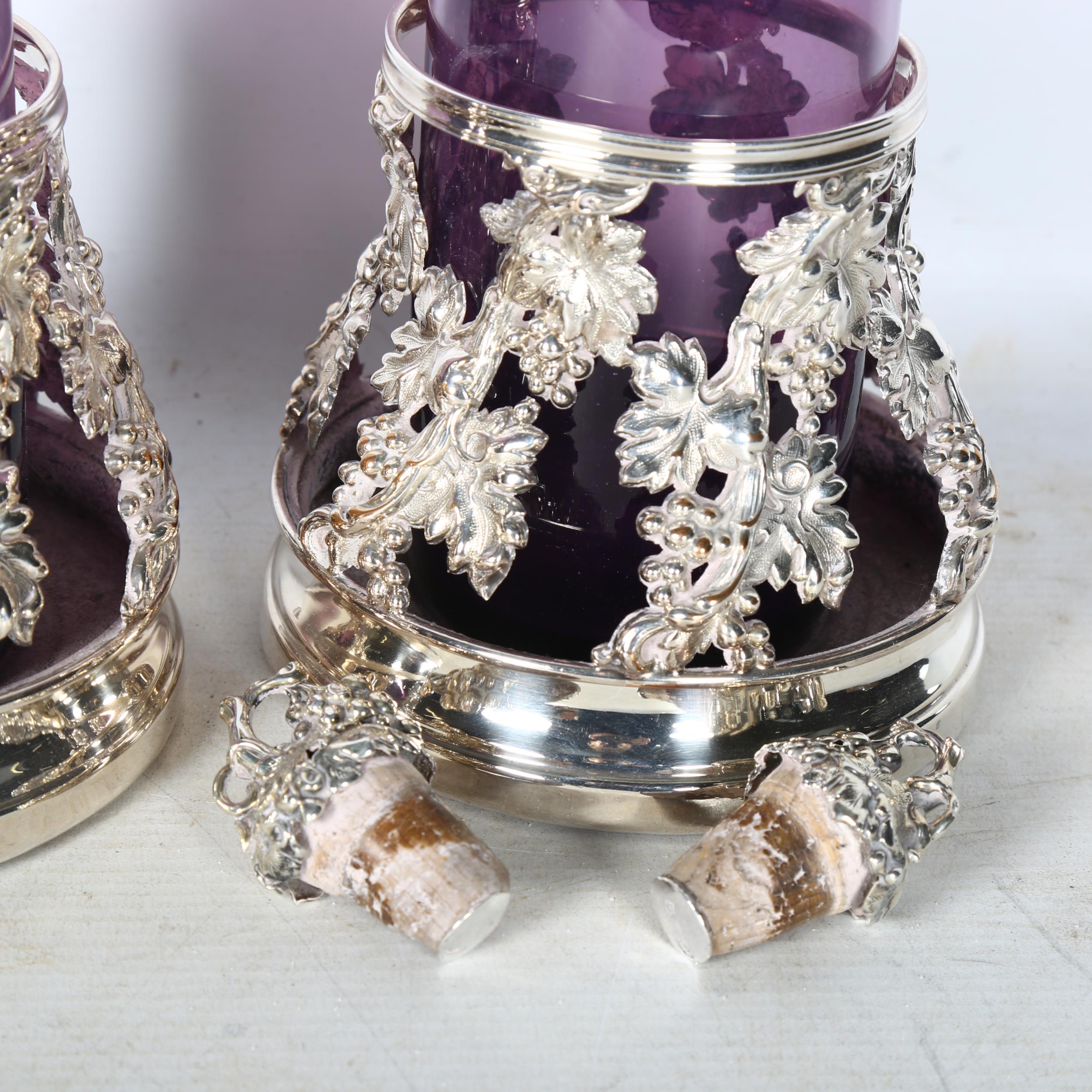 A pair of ornate silver plate on copper wine coasters of raised form, with grape and leaf - Image 2 of 2