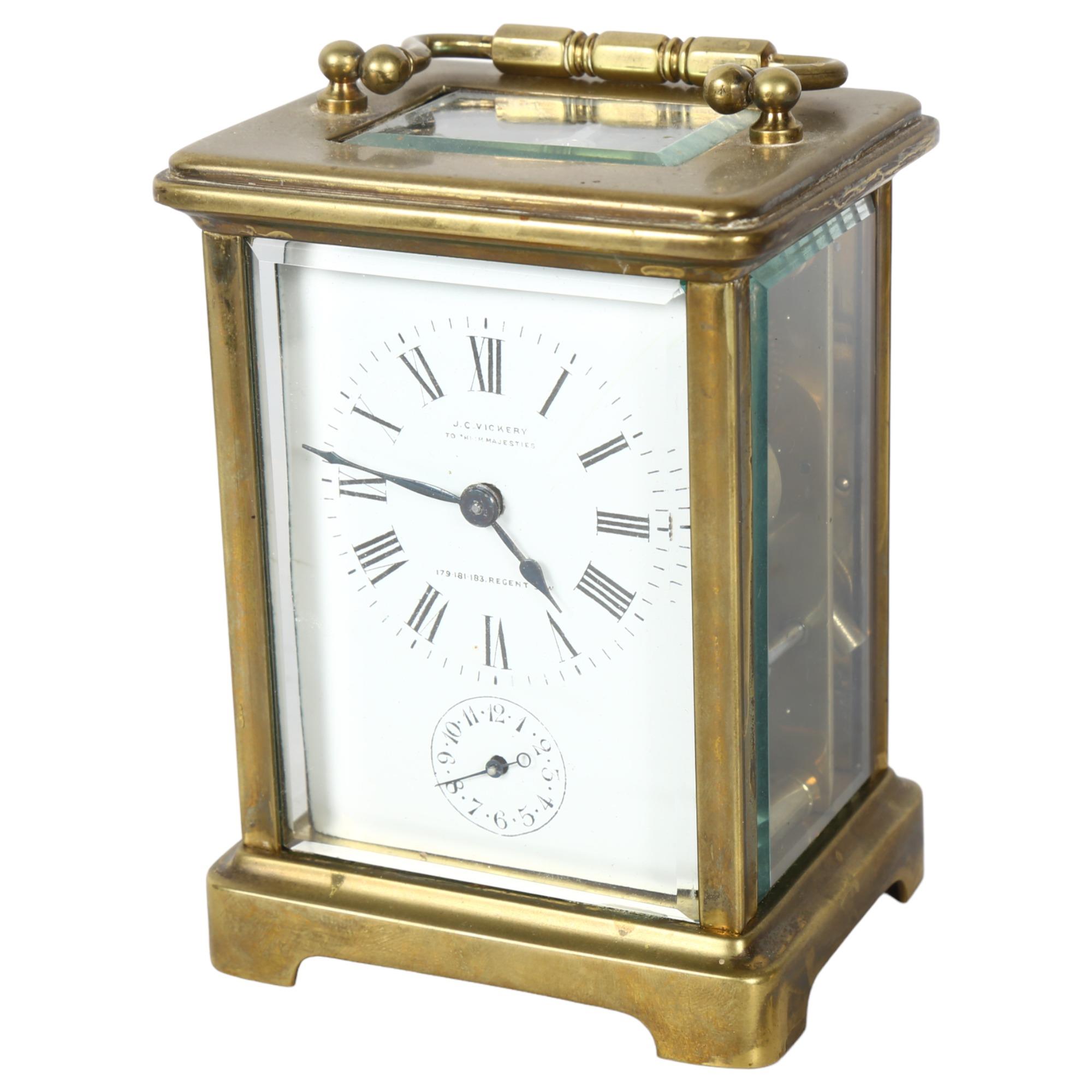 J C VICKERY - a brass-cased carriage clock with enamel dial, Romany numerals and alarm dial,