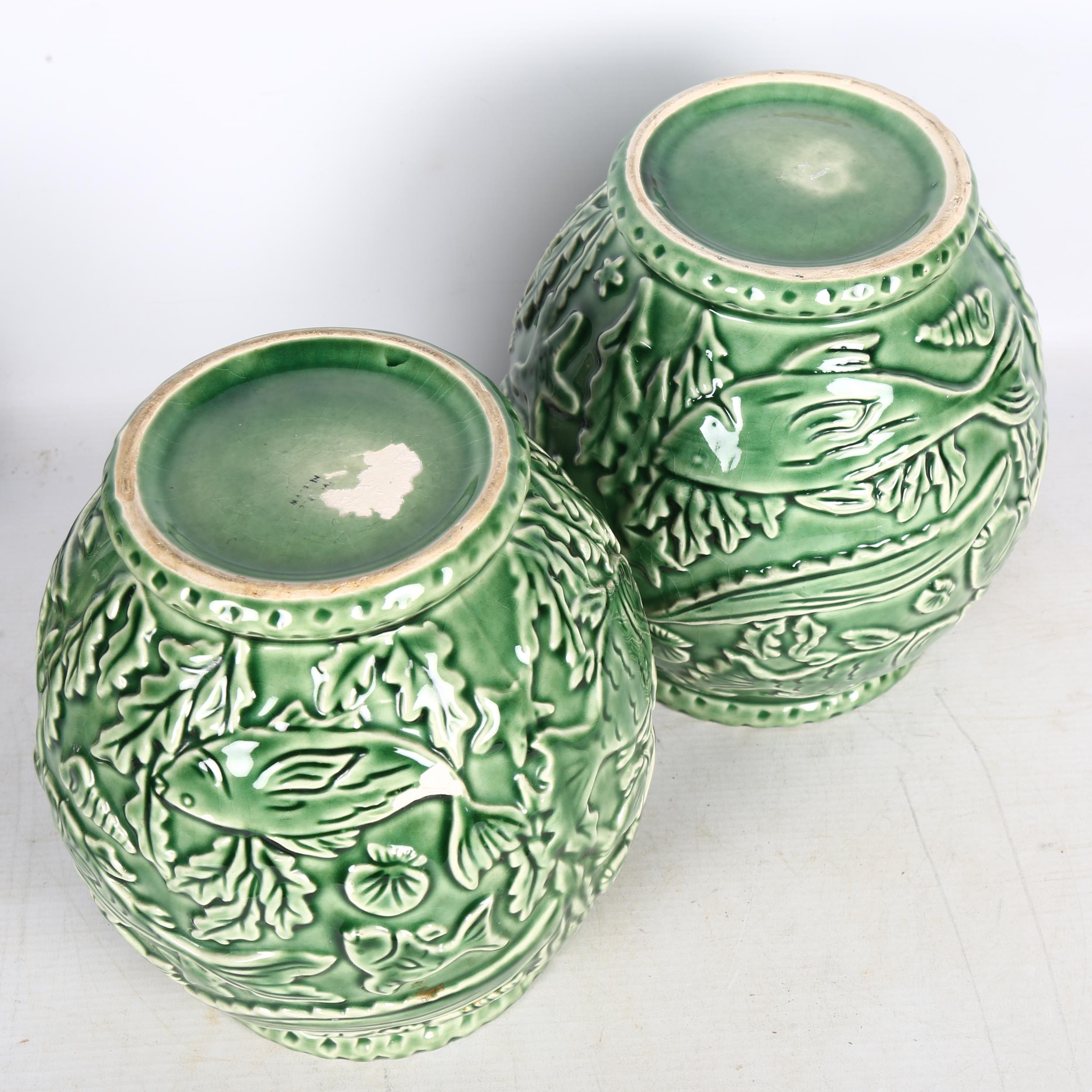 A pair of French green glaze pottery vases, with relief moulded under-sea decoration, height 21cm - Image 2 of 2