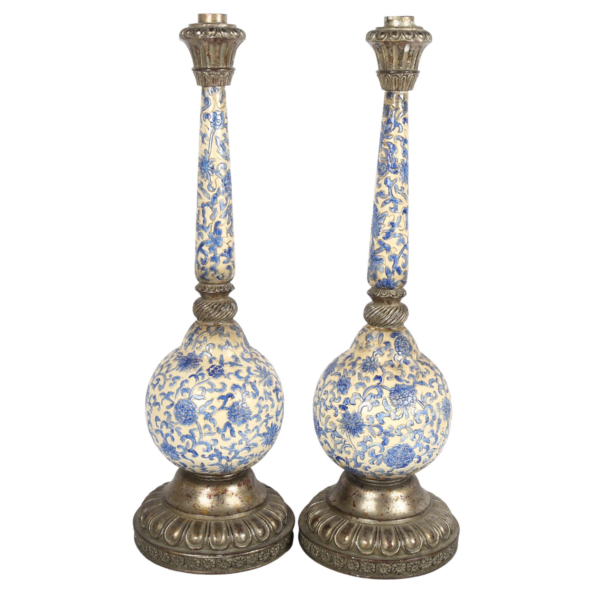 A pair of long-necked stoneware candle stands with metal mounts, H52cm Both appear to have been