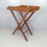 An antique mahogany butler's tray on stand. Overall 75x100x50cm