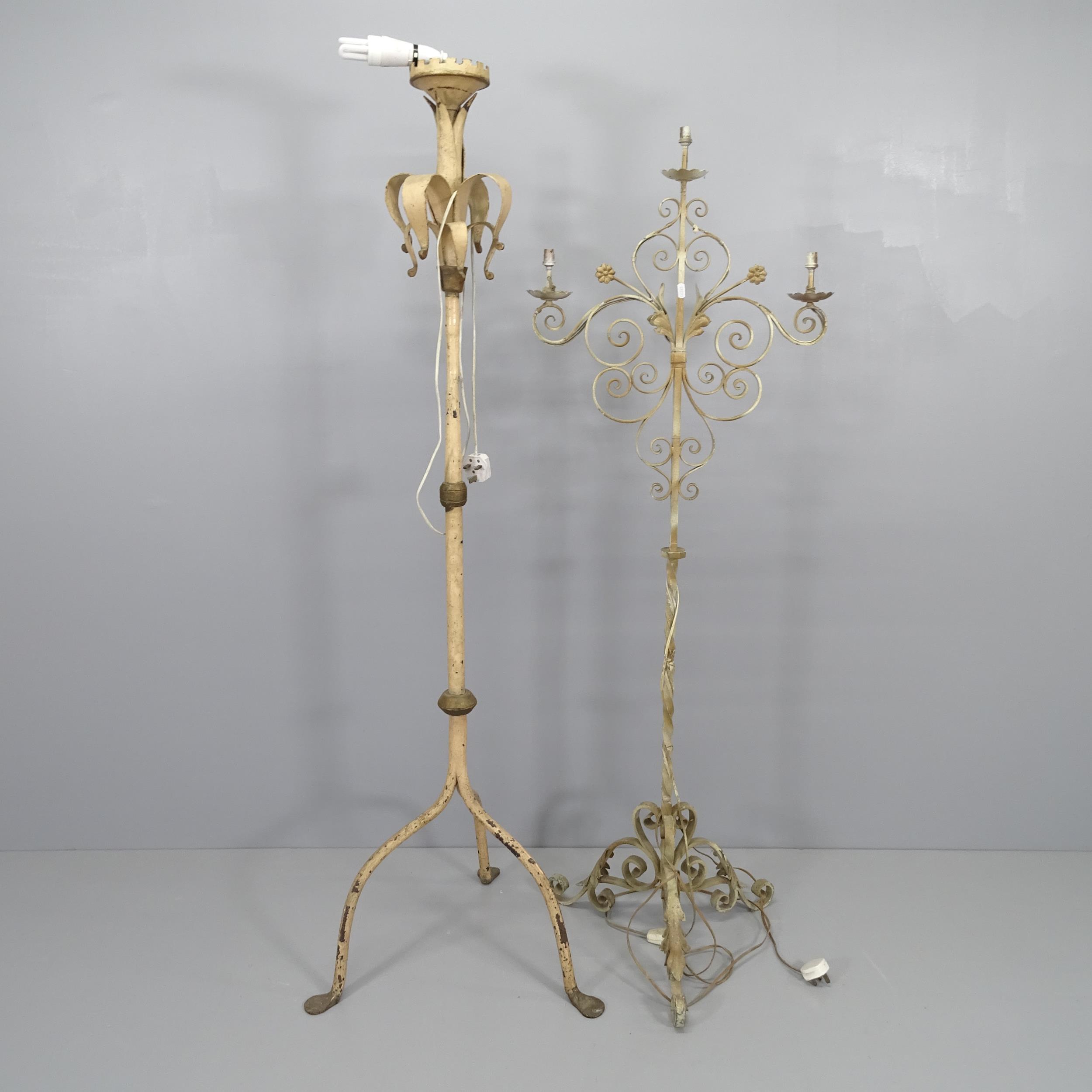 A wrought iron candelabra on tripod base, converted to electric. Height overall 158cm, and a vintage