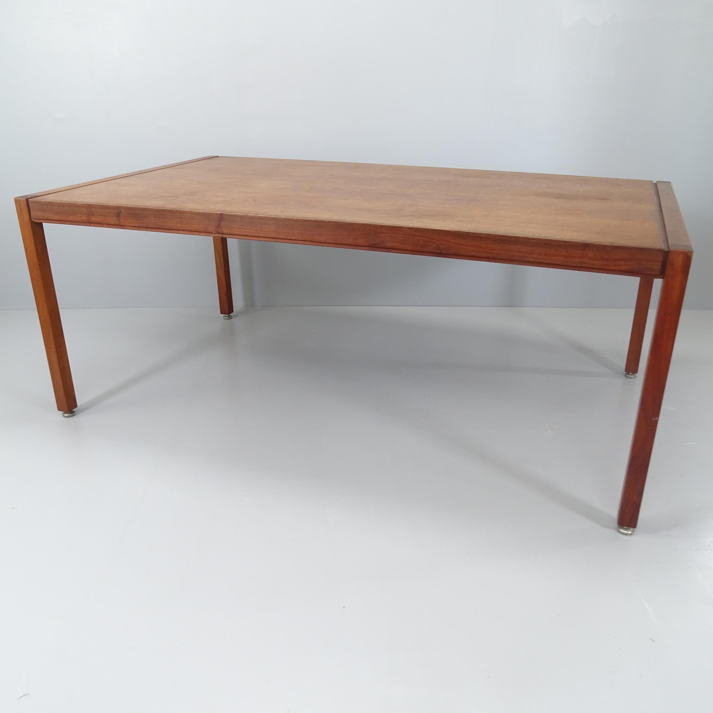 A mid-century teak dining table by Jens Risom for Jens Risom Design Ltd. with maker's label.