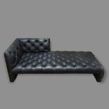 A Wittmann Edwards chaise longue or daybed, in buttoned black leather designed by EDWARD B TUTTLE,