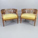 A pair of American Hollywood Regency tub lounge chairs in the manner of Dorothy Draper.