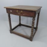 An 18th century oak side table with single drawer, raised on bobbin turned legs with all around