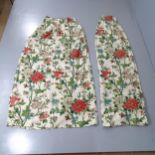 A pair of floral decorated lined curtains. Drop 200cm, hemmed width 228cm.