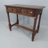 An antique stained oak side table, with single frieze drawer and raised on bobbin turned legs.