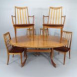 A mid-century teak extending dining table, 165 (extending to 211cm) x72x107cm and six G-plan