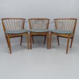 A set of three mid-century teak wishbone dining chairs with faux leather upholstered seats, 1 A/F