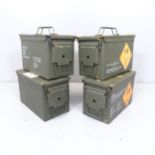 Four military ammunition boxes. 30x19x15cm