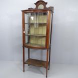 An Edwardian bow front display cabinet with single leadlight glazed door. 66x173x42cm. With key.