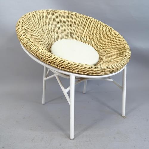 A mid-century style rattan cone chair designed by Terence Conran on white enamel steel base, with