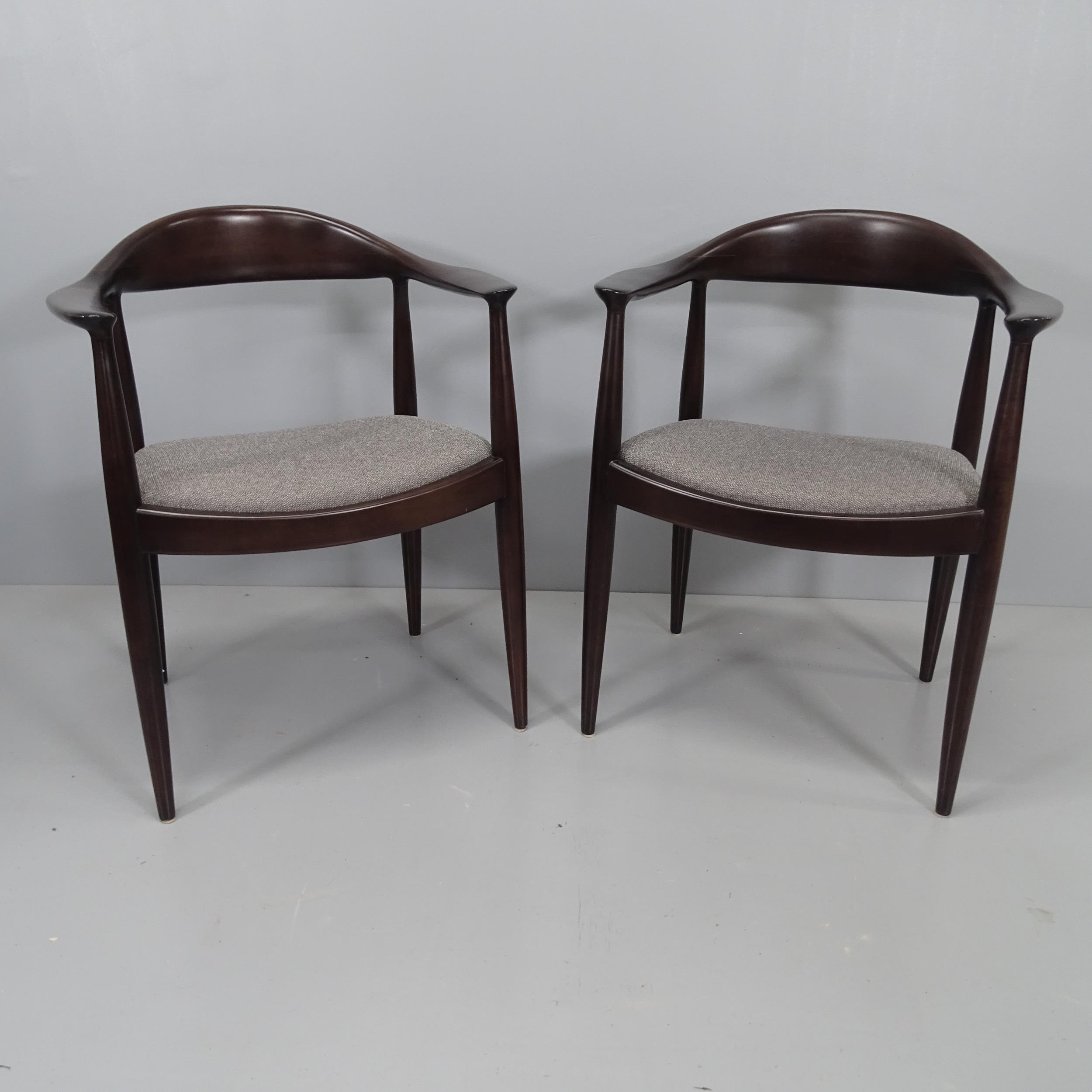 A pair of Hans Wegner Kennedy style armchairs in the mid-century Danish manner.
